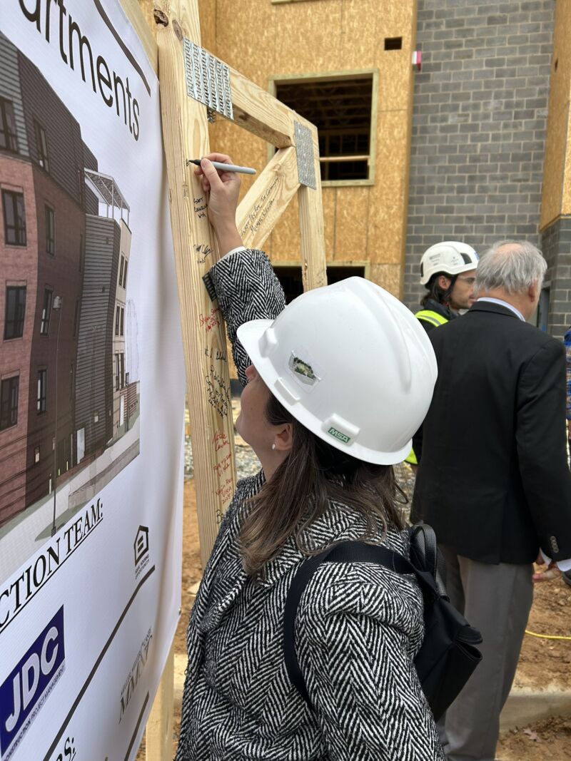 Image for the Tweet beginning: Signing the beam and celebrating